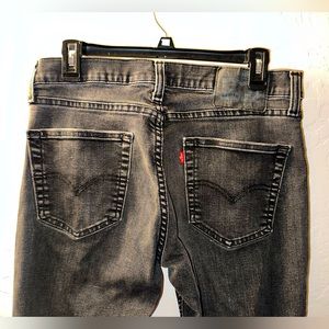 541™ ATHLETIC TAPER WASHED BLACK JEANS